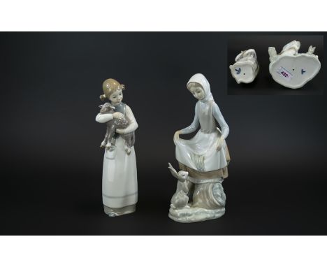 Lladro Hand Painted Pair of Porcelain Figures comprising  1/ 'Rabbit's Food', model no.4826, issued 1972 - 1993, 9 inches (22