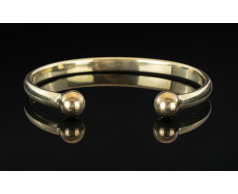 9ct Gold - Solid and Heavy Torque Bangle. Fully Hallmarked for 9.375. Inner Diameter 6.90 cms. 32.4 grams. 