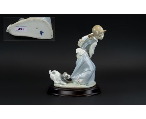 Lladro Hand Painted Porcelain Figure 'Naughty Dog', model no.4982, designer Juan Huerta, issued 1978 - 1995, 8 inches (20cms)