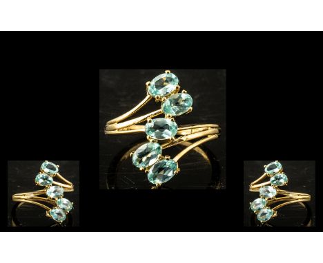 Paraiba Apatite 'Journey' Ring, five oval cut, sparkling, sea blue paraiba apatites trail down the finger, forming the 'Journ