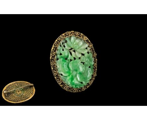 Antique Chinese Green Jade Brooch in a fancy yellow surround, beautifully designed to front and back; 4cms in diameter