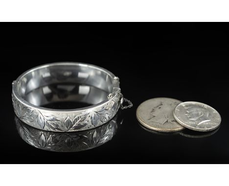 Silver Hinged Bangle, engraved floral decoration to front, fully hallmarked 1966, together with a 1964 half dollar and anothe