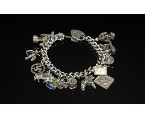 Vintage Sterling Silver Charm Bracelet Loaded with 14 Silver Charms. Both Bracelet and Charms Marked for Silver. Various Subj