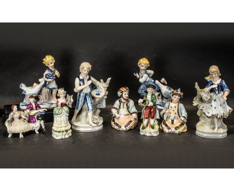 Collection of Pottery Figurines, comprising a pair of 6'' figures of a mana and woman playing musical instruments; a pair of 