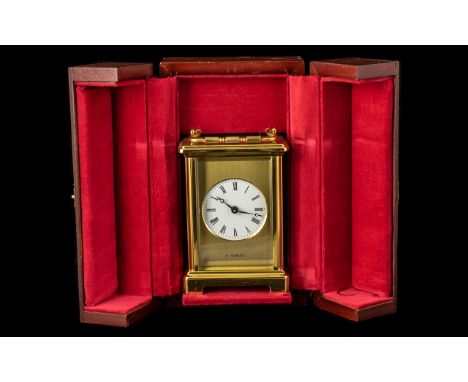 Modern Brass Cased Carriage Clock of Fine Quality With Carrying Handle by H.Samuel, With a Round White Enamel Dial, Working a