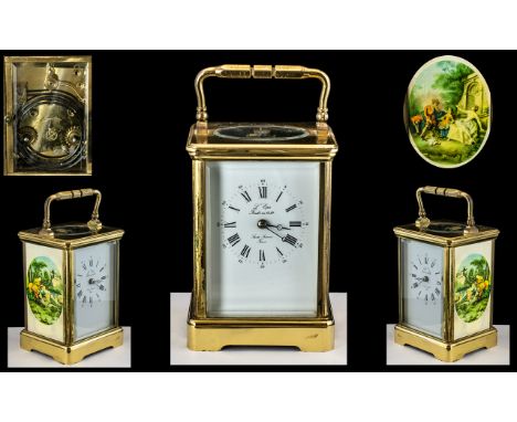 Large Brass Carriage Clock with carrying handle, marked to the enamel dial 'L'Epree - fonde en 1839 - Sante, France'; the sid