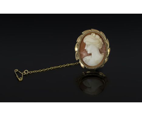 Antique Period 9ct Gold Ornately Mounted Shell Cameo of oval form, with safety chain, marked 9ct; depicts portrait of a young