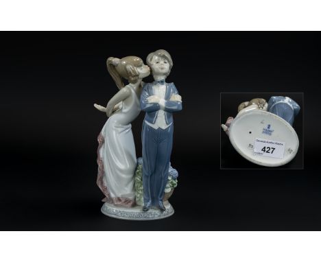 Lladro Hand Painted Porcelain Figure 'Let's Make Up', model no.5555, designer Juan Huerta, issued 1989, 7.75 inches (19.4cms)