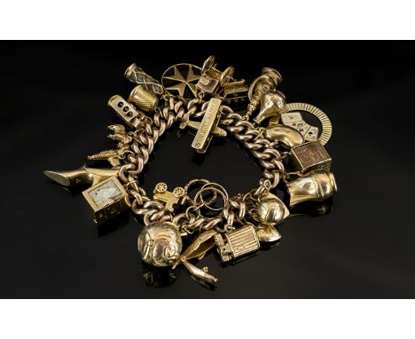 A Vintage 9ct Gold Curb Bracelet Loaded with 25 Superior Quality 9ct Gold Charms. Some Expensive Ones, All Marked for 9ct Gol