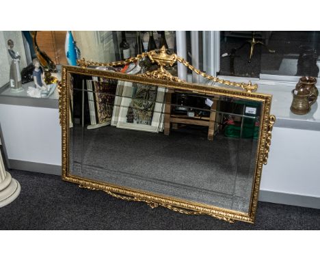 Decorative Over Mantel Mirror, bevelled glass with ornate gilt frame with finial and swags.