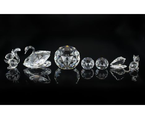 Collection of Seven Swarovski Figures, comprising a swan, 2" tall; a cat with tail 1.5" tall; a squirrel 2/2 tall; an oyster 