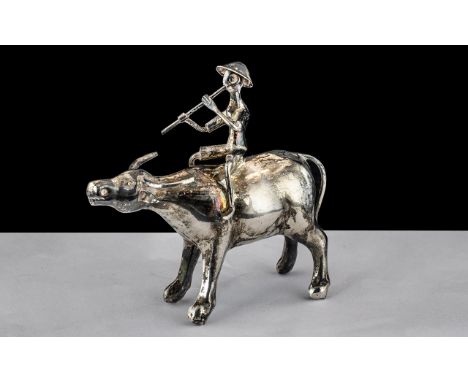 A Fine Chinese Ching Dynasty Antique Silver Model of a Water Buffalo with A Man Riding on Its Back, Playing a Flute. Chinese 