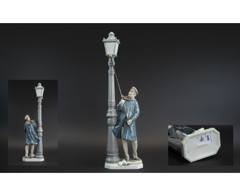 Lladro Hand Painted Tall Porcelain Figure 'Lamplighter', model no.5205, designer Salvador Furio, issued 1984, 19 inches (47.5