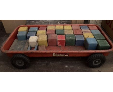 Vintage brick truck made by Triang, with wooden blocks.