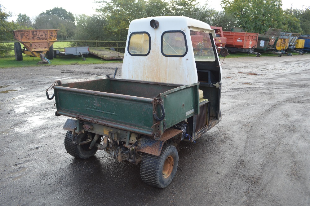 Cushman Truckster 3 wheel utility vehicle. With hydraulic tipping buck