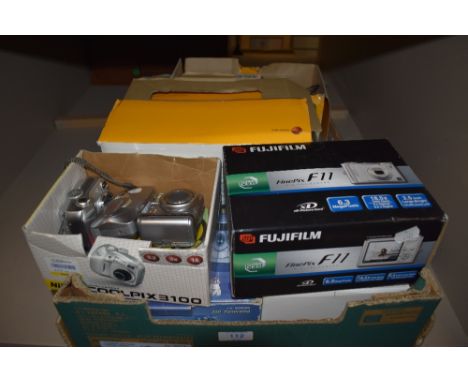 A box of digital cameras, Canon powershot, Olympus Campedia, Nikon Coolpix, Kodak Easyshare, Casio, and as new Fuji Fine Pix