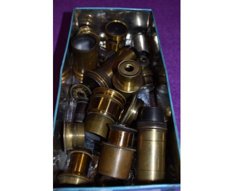 A box of brass lenses and microscope parts
Approx 20 lenses