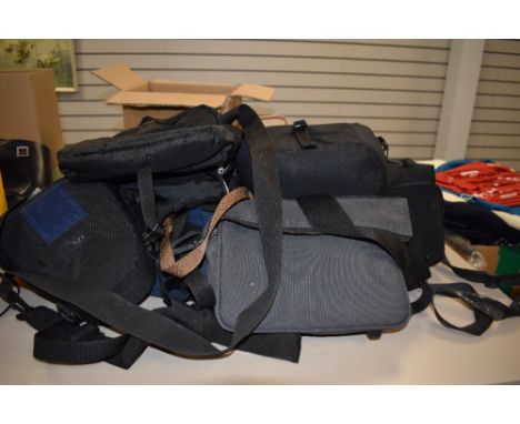 A large collection of camera bags