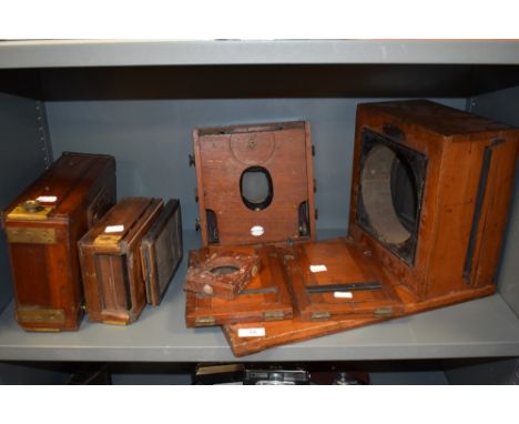 A selection of mahogany camera parts