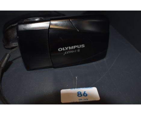 An Olympus MJU II film camera in soft cover