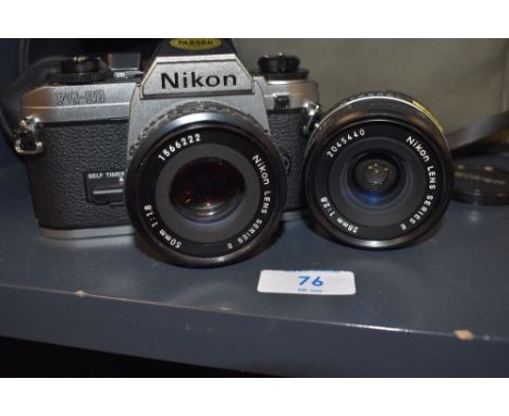 A Nikon FG-20 camera with Nikon series E 50mm and 28mm lens in soft camera bag with filters manuals etc