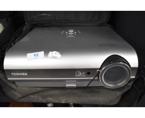 A Toshiba TDP T30 projector in soft carry case