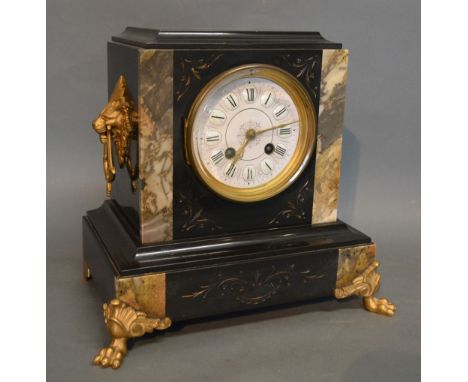 A Victorian Marble and Black Slate Mantle Clock, the enamel dial with Roman numerals and two train movement, 26 cms tall
