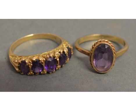 A 9ct Gold Amethyst Dress Ring set with five graduated amethysts within a pierced setting together with a 9ct gold ring set w