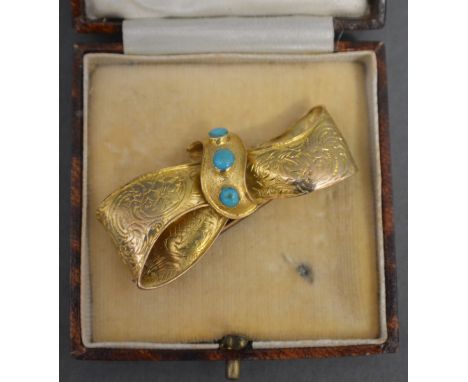 A Gold Brooch of Bow Form set with three Turquoise within fitted case