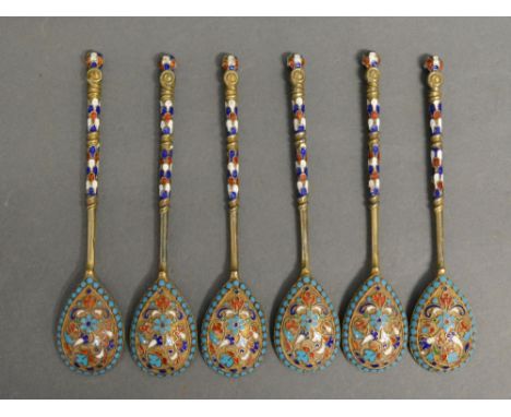 A Set of Six Russian Silver Gilt and Enamel Decorated Spoons, each marked 84, 10.5 cms long