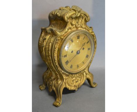 A 19th Century French Heavy Ormolu Mantle Clock, the gilt dial with Roman numerals and two train movement striking on a bell,