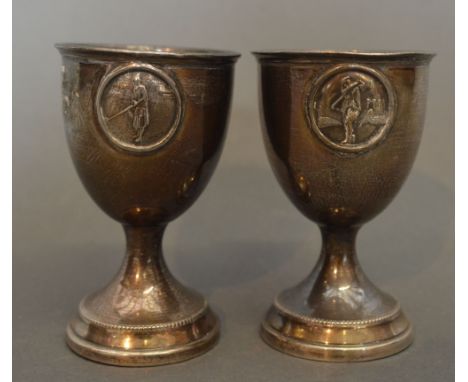 A Pair of London Silver 'His and Hers' Egg Cups, Golf Related