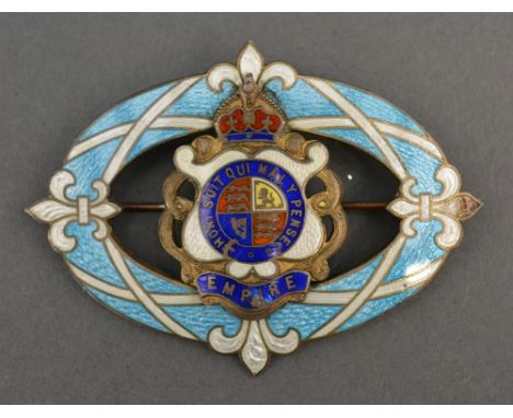 A Sterling Silver and Enamel Royal British Empire Badge of Oval Form decorated with fleur de lis and silver gilt reverse, 5.5