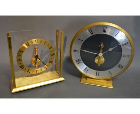 A Jaeger Le Coultre Table Clock with Inline Movement, 18 cms diameter, together with another Jaeger Le Coultre Mystery Clock 