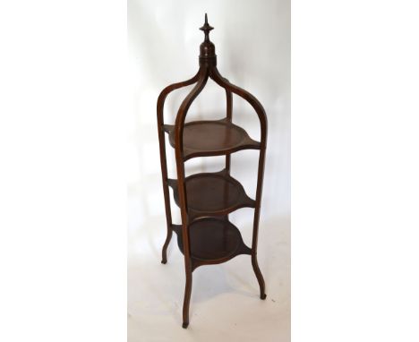 A Late 19th Century Mahogany Three Tier Cake Stand with shaped supports and turned finial, 98 cms tall
