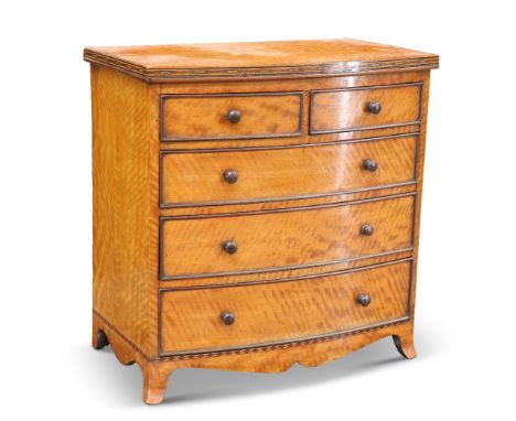 A FINE EARLY 19TH CENTURY SATINWOOD BOW-FRONTED MINIATURE CHEST OF DRAWERS, the top with inlaid edge above two short over thr