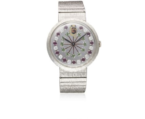 A RARE GENTLEMAN'S 18K SOLID WHITE GOLD GUBELIN BRACELET WATCH  CIRCA 1970s, WITH SOLID GOLD RUBY & DIAMOND SET DIAL, DEPICTI