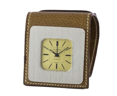 A HERMES PARIS TRAVEL ALARM CLOCK   CIRCA 1970sMovement: Mechanical.Case: Approx. 40mm by 40mm, brushed metal case, brown lea