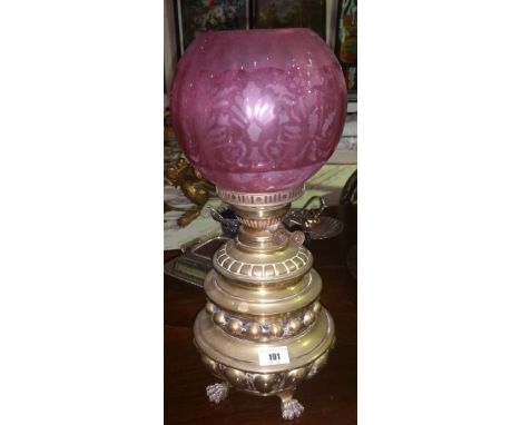 A Lovely Brass Oil Lamp with Ruby Shade.