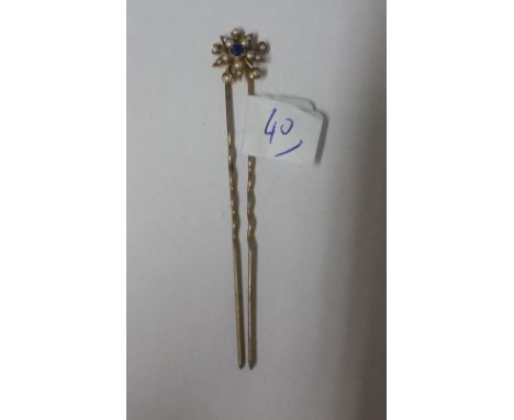 An Antique Gold Sapphire and Pearl Pin.