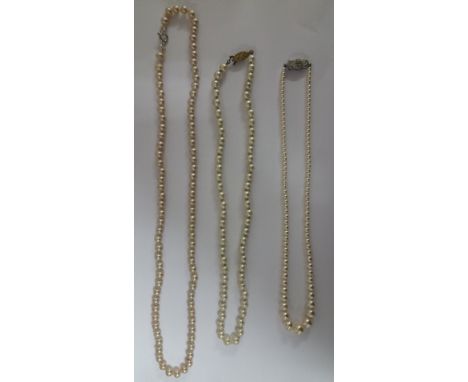 Three Single Strand Pearl Necklaces.