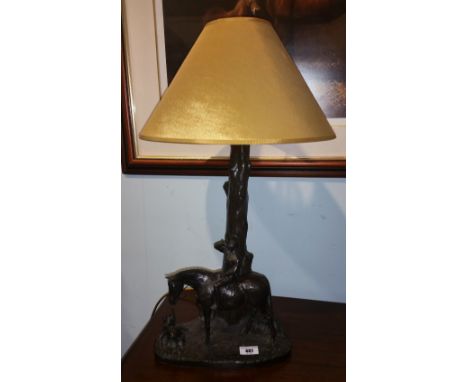 A Genesis Bronzed Table Lamp in the Form of a Hunter.