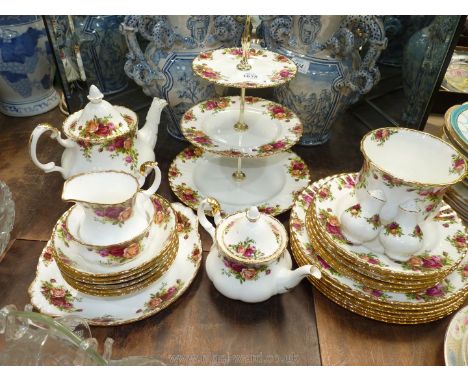 A Royal Albert "Old Country Rose" Dinner and tea service comprising six dinner, six dessert plates, six cereal bowls, three t