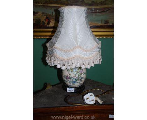 A cream lamp decorated with ducks and water plants, 11" tall, cream silk shade 17" tall.