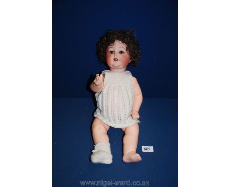 An Armand Marseille bisque headed character Doll with open and closing eyes, and marked Germany 990 A 7 M to rear of neck, mo