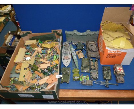 A quantity of Army trucks, boats, Army people and landscaping, etc.
