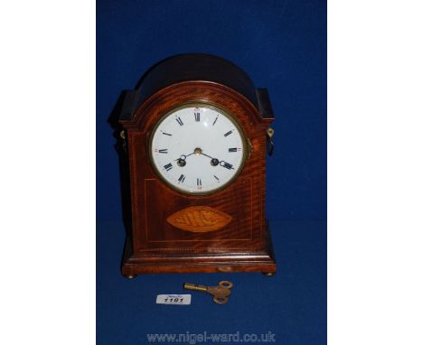 A French Walnut chiming mantle Clock with marquetry shell detail to front, 10'' tall, with key
