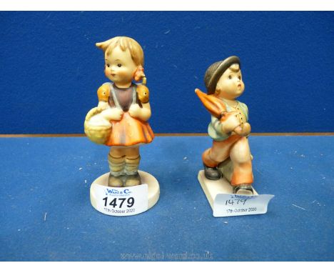A Hummel figure of a young girl with her school bag and basket ''School Girl'' and a young man with his bag and umbrella ''Me