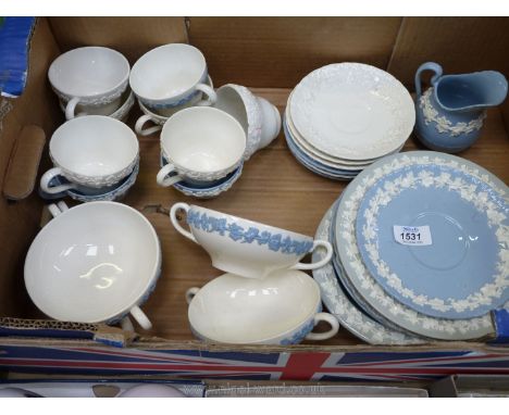 A quantity of Wedgwood Queens Ware of various colours to include; nine cups (3 a/f), six saucers (3 a/f), four soup bowls, mi