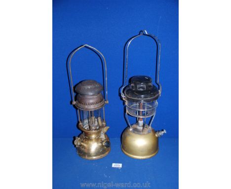 A brass storm Tilly lamp, 13'' tall plus a Hipolito brass paraffin lamp, 12 1/2'' tall